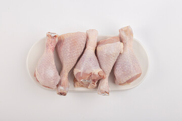 Raw chicken legs isolated on white background