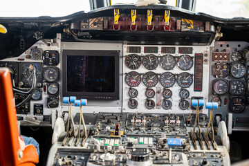 The cockpit of an airplane with multiple instruments