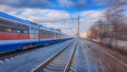 Fototapeta premium electric passenger train Drive at high speed amidst the urban landscape.