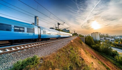 Obraz premium electric passenger train Drive at high speed amidst the urban landscape.