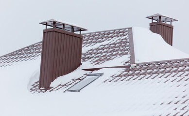 A chimney with snow on it © schankz