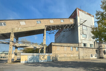 A large building with a lot of windows and a ramp leading up to it