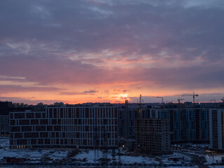 dramatic sunset over construction site