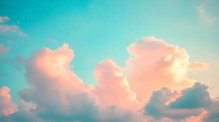 Pastel Pink and Teal Cloudscape: A Dreamy, Softly Lit  Abstract Background Image of Fluffy Cumulus Clouds Illuminated by Sunset Hues.