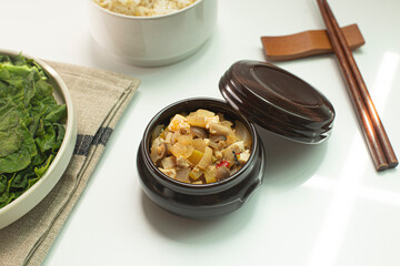 green pumpkin leaves cooked in hot steam, soybean paste.