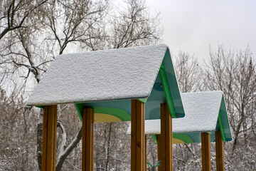 snow-covered roofs of the playground towers