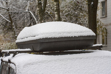 a snow-covered car  roof rack