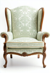 An antique wing chair with golden trim