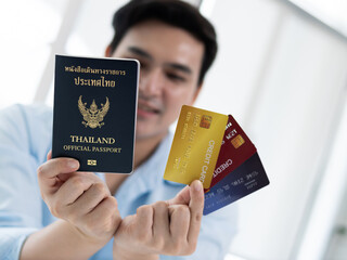 Travel preparation showing thailand passport and credit cards office environment close-up view...