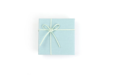 Top view, green gift box tied with a bow isolated on white background. Gift box concept for a happy birthday, thank you, congratulation, mother's day, anniversary, Valentine's Day, or other holidays..