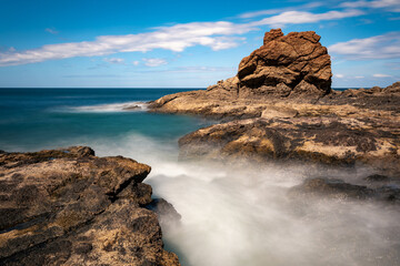 Long exposure, pacific ocean waves on rock in Playa Ocotal, El Coco Costa Rica