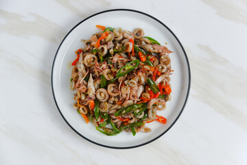 stir-fried salted squid with green chili. Perfect for recipe, article, catalogue, or any commercial purposes. with copy space.