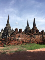 Fototapeta premium Ancient Brick Wall and Stupas in Ayutthaya, Thailand.