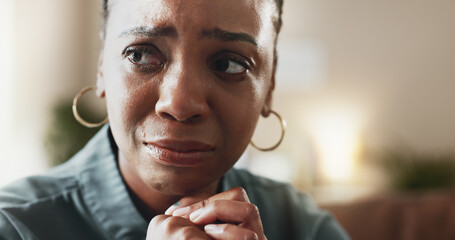 Crying, sad face and black woman with depression, thinking and psychological trauma in home living room. Tears, unhappy and African person with anxiety for crisis, mental health challenge and stress