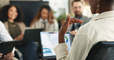 Laptop, hand and businesswoman in group meeting with graph, financial data and leader planning. Computer, team or manager brainstorming stats for risk management, kpi or discussion in office workshop