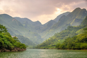 The Nho Que River in Ha Giang Province, northern Vietnam. The river winds through the towering...
