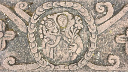 Colonial era stone carving of the Virgin Mary and the Jesus Christ child in a traditional Spanish...
