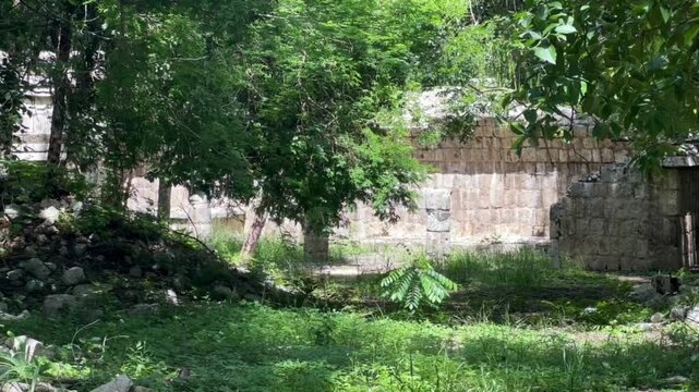 Handheld wide shot of the ruins of the Mayan steam bath or temazcal at Chichen Itza in Yucatan, Mexico. 4K