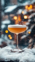 Elegant winter cocktail in a coupe glass, garnished with star anise, set against a snowy backdrop and warm bokeh lights.