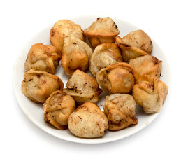 fried dumplings in a plate on a white background