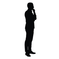 A man is standing in front of a white background. He is wearing a suit and is thinking
