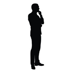 A man is standing in front of a white background. He is wearing a suit and is thinking
