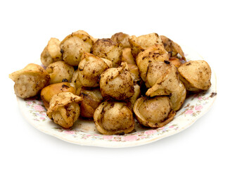 fried dumplings in a plate on a white background