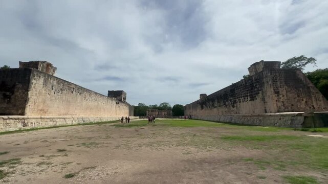 Handheld wide angle booming down shot of the Great Mayan Ball Court at Chichen Itza in Yucatan, Mexico. 4K