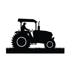 Obraz premium A man is driving a tractor. The tractor is black and has a large tire. The man is wearing a hat