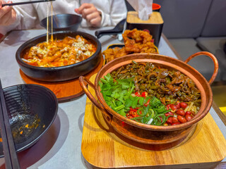 Korean cheese toppoki and Chinese oil dry noodles served with deep-fried chicken served in a restaurant in New Zealand