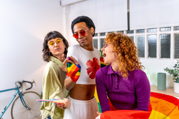 Friends celebrating diversity partying at home with lgbt flag