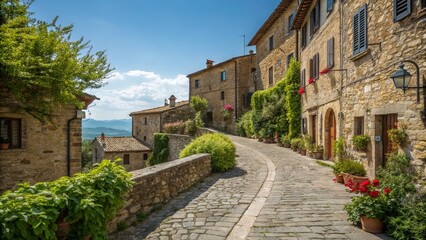 Fototapeta premium Charming Anghiari: A Serene View of a Quaint Street in the Historic Borgo with Stone Buildings and Lush Greenery Framing the Pathway Under a Clear Blue Sky