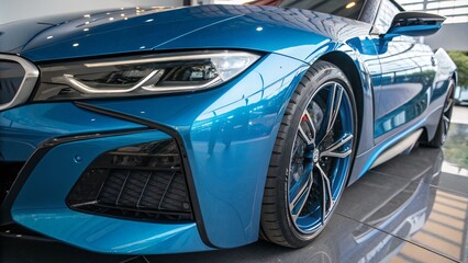 Closeup of a Futuristic Car with Bluelit Chrome Exterior Captured with Rule of Thirds Composition for Automotive Enthusiasts and Technology Lovers