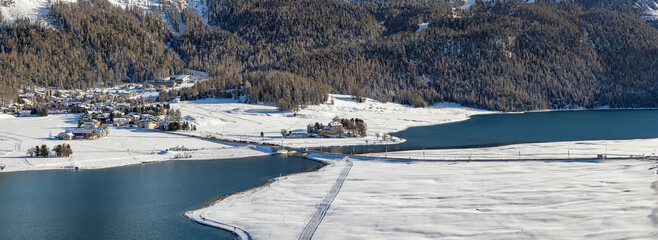 Panorama of Silvaplana lake in winter from high view to St. Moritz in Engadine in Switzerland