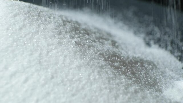White Finely Ground Rock Salt Pour Slow Motion.