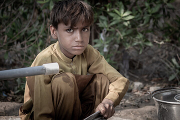 Fototapeta premium Pensive Portrait of an Indian Young Rural Boy