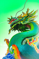 Dragon Series : Green dragon statue against the backdrop of sky
