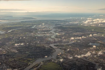 Aerial view of city of Rotterdam with harbour, river and skyline