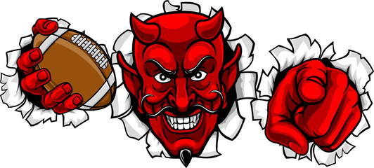 A devil man holding American football ball, breaking through the background and pointing sports team mascot illustration.