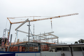 Construction crane over a commercial building.