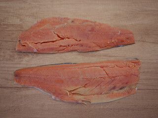 Salmon fillets ready for processing in the kitchen. Salmon is one of the most nutritious types of...