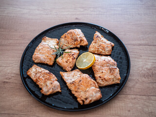 Baked salmon fillets and cod in butter. A healthy lunch of fish full of vitamins and healthy fats.