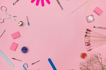 Manicure and pedicure tools on a pink background. Top view with a place to copy. Nail salon banner...
