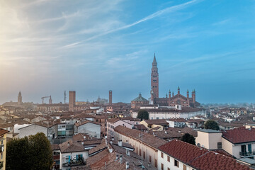 Obraz premium Charming city of Cremona in italy sunset, showcasing rooftops, the duomo, the torrazzo bell tower