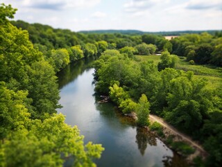 Fototapeta premium Serene River Flowing Through Lush Green Foliage with Gentle Water Reflections in a Tranquil Natural Landscape Capturing the Essence of Peace and Harmony in Nature