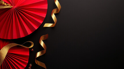 Minimal background with red paper fans and gold ribbons creating festive atmosphere