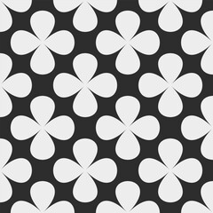 Seamless floral pattern with bold white clover shapes and rounded petals on a contrasting background. High quality geometric vector design in retro style for decor, wallpaper, and print. Y2K style.