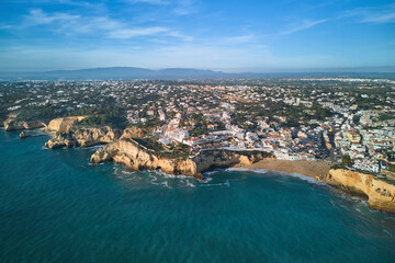 Aerial panoramic view of the Carvoeiro and Lagoa villages and Monchique mountain range in Portugal