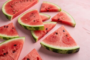Vibrant Watermelon Slices on a Pink Background Captured in Low Light Photography for a Fresh and Colorful Culinary Experience