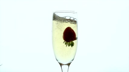 Single strawberry dropping into a champagne flute creates an elegant splash against a clean white background - Powered by Adobe